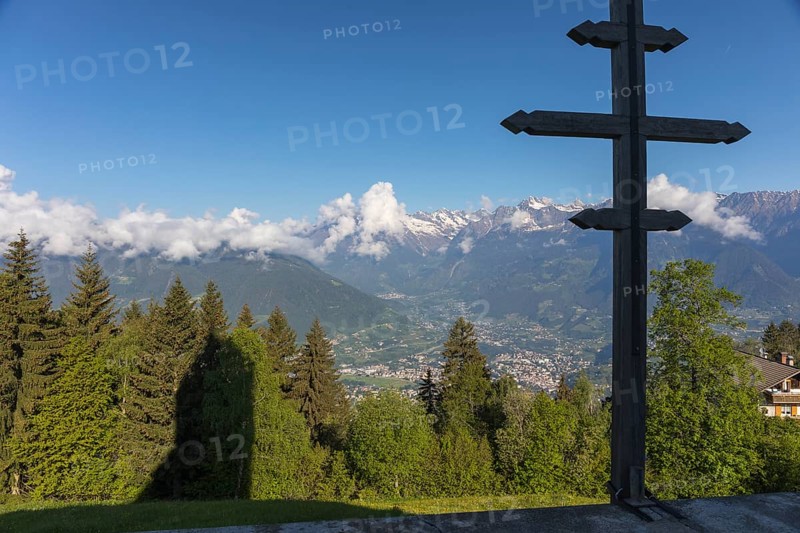 Church St. Kathrein, 39010 Hafling, Italy with the city of Meran in the background. The church is from the 13 th century