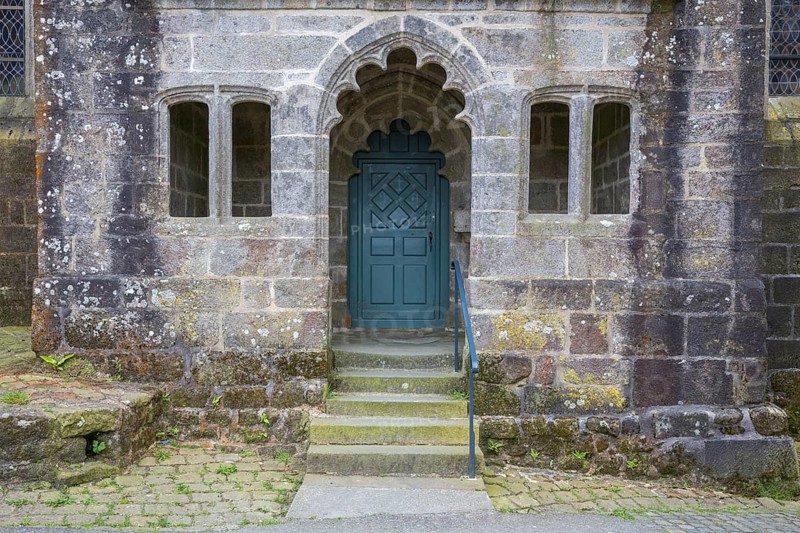 Side entrance of St Ronan church in Locronan village, Finistère department of Brittany in north-western France