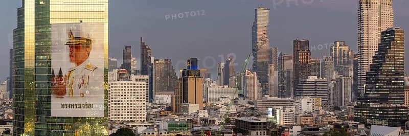 Panorama from the viewing platform of the Iconsiam on CAT Tower with huge billboard of the Thai King Maha Vajiralongkorn, skyscrapers, hotels and the banking district Bang Rak, skyline of Bangkok, Thailand, Asia