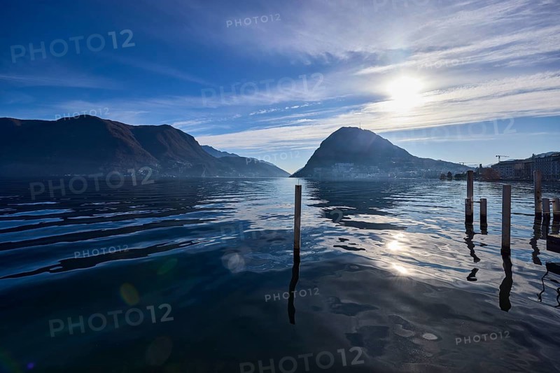 Lake, Duckdalben, mountain landscape, backlight of the sun, blue sky, veil clouds, Lake Lugano, Lugano, district Lugano, canton Ticino, Switzerland, Europe