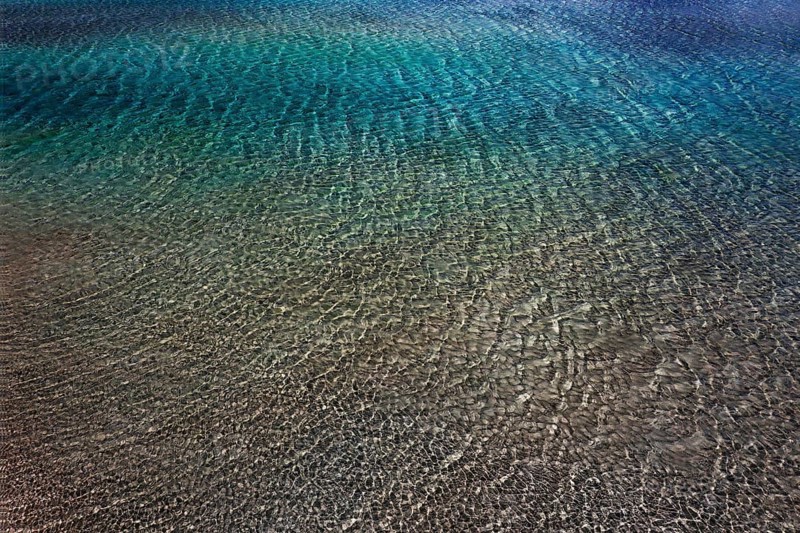 Drone shot, glittering water surface on the beach of Elafonisi, west coast, Crete, Greece, Europe