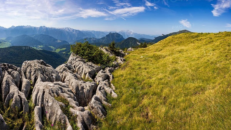 At the summit of Alpbichl with a view of the Lammertal and Tennengebirge mountains, Osterhorn group, Salzkammergut, Salzburg province, Austria, Europe