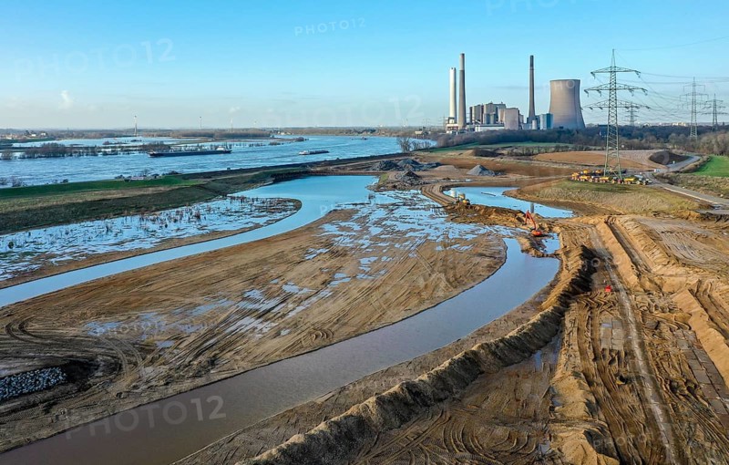 Dinslaken, North Rhine-Westphalia, Germany, New Emscher estuary into the Rhine. Construction site of the new Emscher estuary in front of the decommissioned STEAG coal-fired power station in Voerde. The mouth of the Emscher into the Rhine is being moved almost 500 metres north from Dinslaken to Voerde. Fish will then be able to swim barrier-free up the new Emscher from the Rhine through a newly created floodplain area. Following the construction of a parallel sewer, the Emscher has been completely free of sewage since January 2022. The river was previously an open, above-ground combined sewer with rainwater and wastewater, Europe