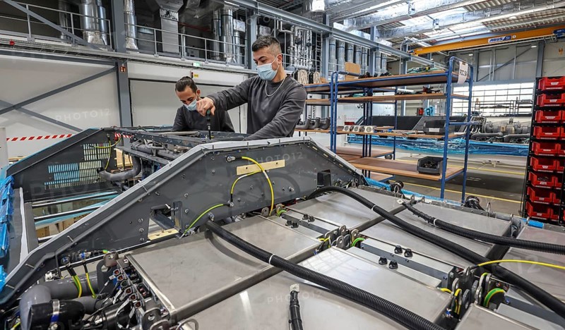 Herten, North Rhine-Westphalia, Germany, Cummins Hydrogenics fuel cell factory. Employees assemble fuel cell systems for Alstom's Coradia iLint hydrogen trains. The Coradia iLint is the world's first passenger train to be powered by a hydrogen fuel cell, which generates electrical energy for propulsion. Six fuel cell modules are installed on each train (right in the picture) . Note: The people pictured have given their verbal consent for publication in the press, Europe