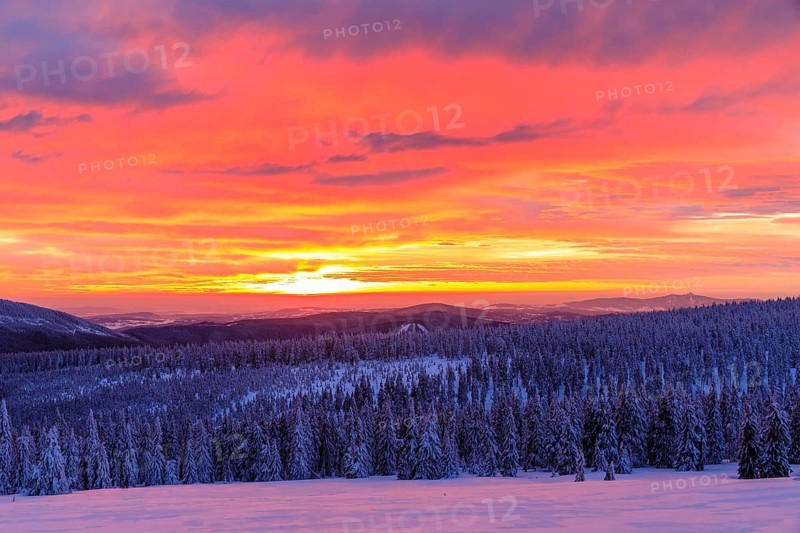 Sunset on a winter evening at the Wossecker Baude above Harrachsdorf in the Giant Mountains, in the background the Jeschken (Ješted), Czech Republic, Europe