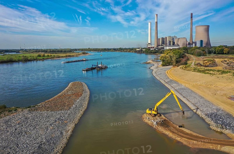 Dinslaken, Voerde, North Rhine-Westphalia, Germany, Emscher estuary into the Rhine. Construction site of the new Emscher estuary in front of the decommissioned STEAG coal-fired power station in Voerde. The mouth of the Emscher into the Rhine is being moved almost 500 metres north from Dinslaken to Voerde. Fish will then be able to swim barrier-free up the new Emscher from the Rhine through a newly created floodplain area. Following the construction of a parallel sewer, the Emscher has been completely free of sewage since January 2022. The river was previously an open, above-ground combined sewer with rainwater and wastewater, Europe