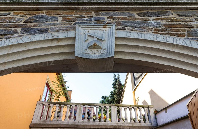 Architectural combination of old and new, keystone with initials and sandstone railing of a terrace in the inner courtyard, Färbergasse, Freiberg, Saxony, Germany, Europe