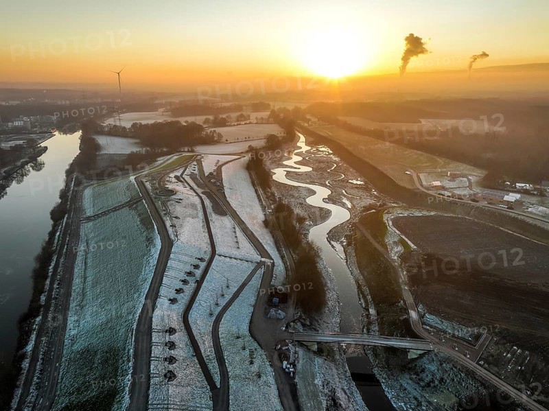 Recklinghausen, Castrop-Rauxel, North Rhine-Westphalia, Germany, winter landscape, EMSCHERLAND construction project, a 37-hectare water and nature discovery park at the water crossroads of the Rhine-Herne Canal (left) and the renaturalised Emscher (right) on the city limits of Recklinghausen and Castrop-Rauxel. The ecological focus at the confluence of the Suderwicher Bach (far right) and Emscher will also be a future garden for the International Garden Exhibition 2027. Before the renaturalisation, the Emscher river system was an open, above-ground wastewater channel, combined sewer with surface water and wastewater, Europe
