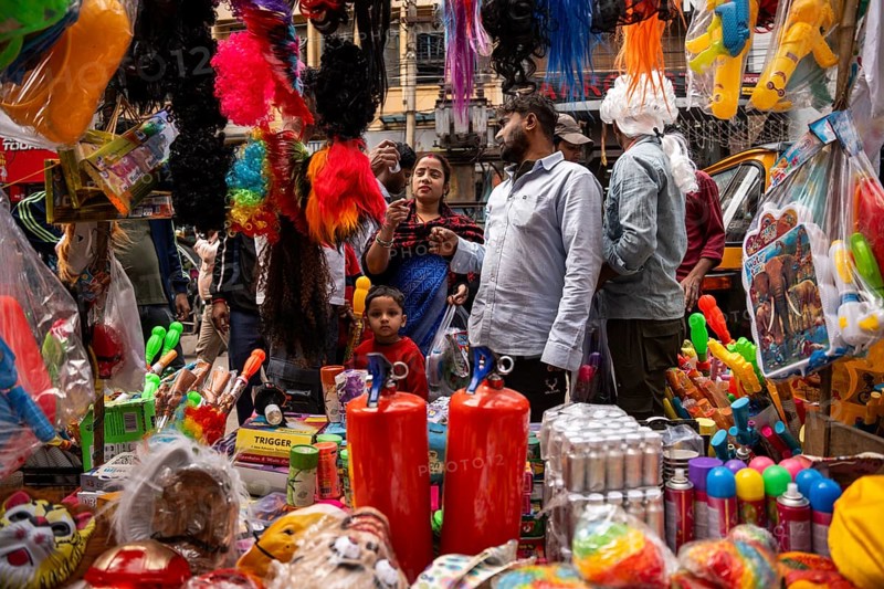People buy Holi celebration items in a market on the eve of Holi Festival, on March 13, 2025 in Guwahati, India. Holi is a Hindu festival celebrated mainly in India marking the arrival of spring it is also known as the Festival of colors, as people throw vibrant colored powders at each other, dance, and celebrate with music and sweets