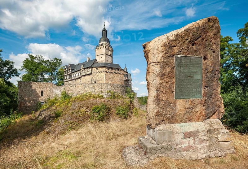 Falkenstein Castle in the Harz Mountains, in front the memorial stone for Eike von Repgow, Meisdorf, Saxony-Anhalt, Germany, Europe