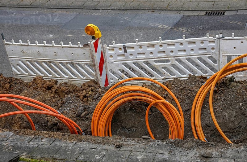 Müheim an der Ruhr, North Rhine-Westphalia, Germany - Internet broadband expansion, Westnetz construction site laying fibre optic cable, fast Internet, DSL cable connection for households