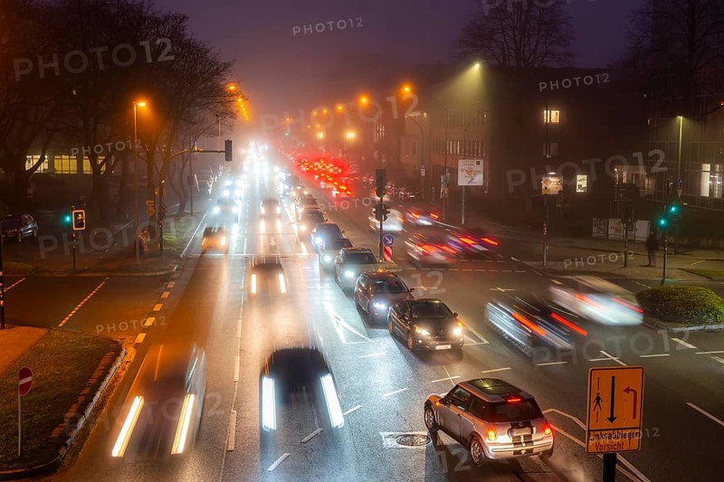 Dense fog, with visibility sometimes less than 100 metres, city centre traffic at rush hour on Alfredstraße, B224, in Essen, North Rhine-Westphalia, Germany, Europe
