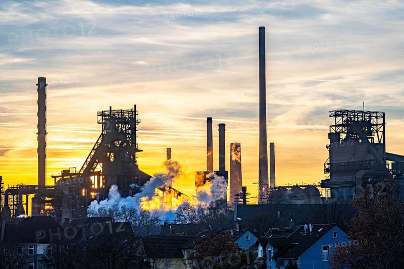Blast furnace Schwelgern 1 and 2, ThyssenKrupp Steel Schwelgern plant in Duisburg-Marxloh is part of the Bruckhausen steelworks, sunset, North Rhine-Westphalia, Germany, Europe