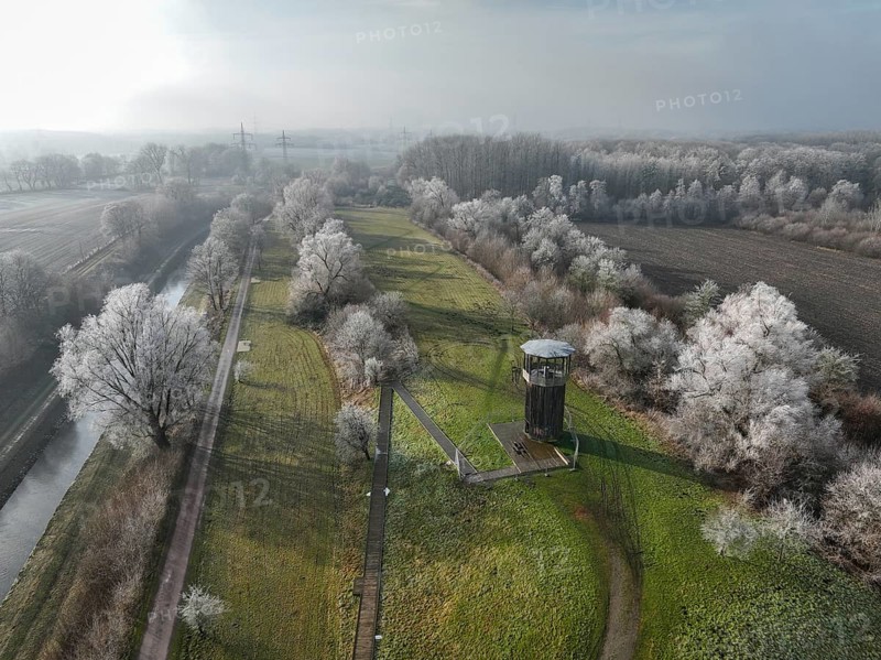 Recklinghausen, Castrop-Rauxel, North Rhine-Westphalia, Germany - Winter landscape EMSCHERLAND, here at the Kawamata Tower, Walkway and Tower observation tower, EMSCHERLAND is a 37-hectare water and nature adventure park at the water crossroads of the Rhine-Herne Canal and the renaturalised Emscher on the city boundary of Recklinghausen and Castrop-Rauxel. EMSCHERLAND will also be a garden of the future for the International Garden Exhibition 2027. Before the renaturalisation, the Emscher river system was an open, above-ground wastewater channel, mixed water channel with surface water and wastewater