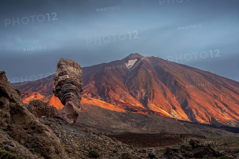 Panorama at sunrise on the Roque Chinchado, also known as the Stone Tree or Finger of God, landmark of the island, Los Roques de Garcia, behind it the Pico del Teide, 3717m, Las Cañadas, Teide National Park, Tenerife, Canary Islands, Spain, Europe