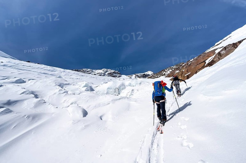 Ski tourers on an alpine tour on the Fürkeleferner glacier, snow-covered mountain landscape in winter, ascent to Monte Cevedale, Ortler Alps, Vinschgau Valley, Italy, Europe