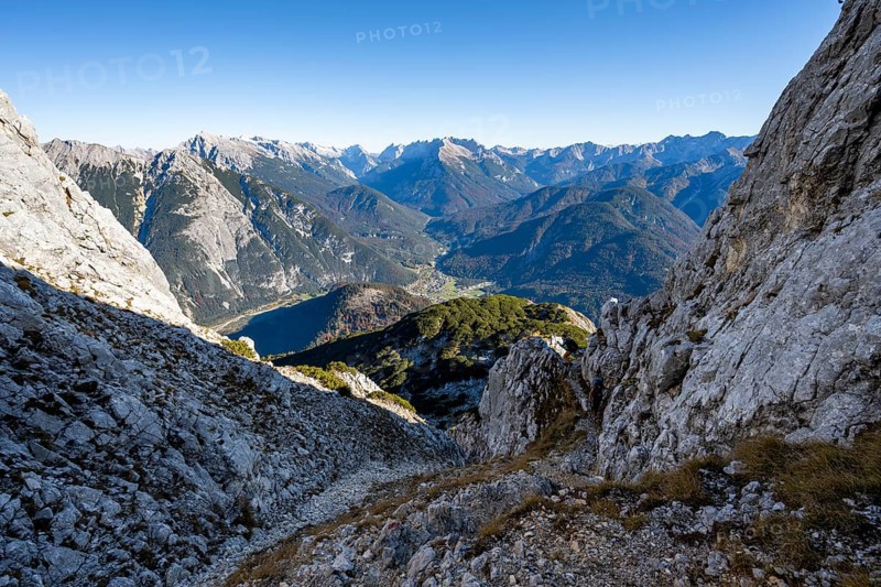 Mountain landscape in autumn, ascent to the Große Arnspitze, view into the valley to Scharnitz with Pleisenspitze, near Scharnitz, Bavaria, Germany, Europe