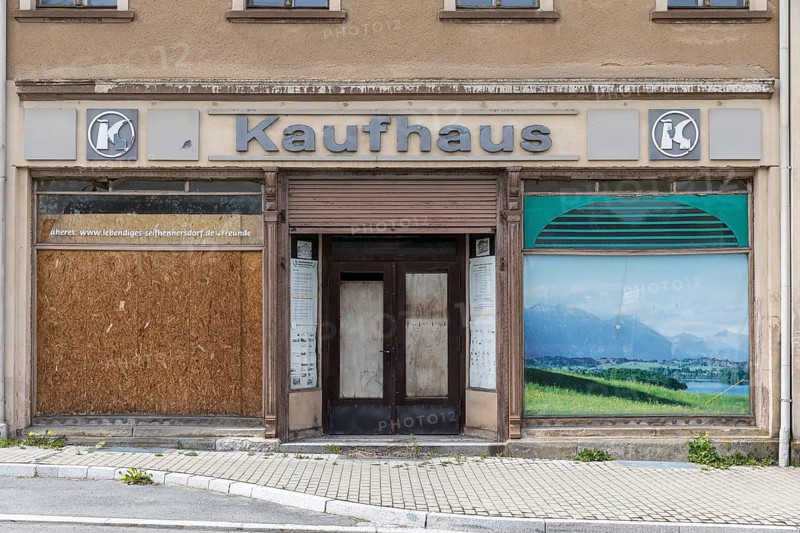 Former entrance to the department stores', old building on Zollstraße, still with Konsum logo, Seifhennersdorf, Zittauer Gebirge, Saxony, Germany, Europe