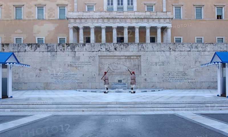 Evzones at the changing of the guard at the Tomb of the Unknown Soldier in front of the Parliament at Syntagma Square, Athens, Greece, Europe