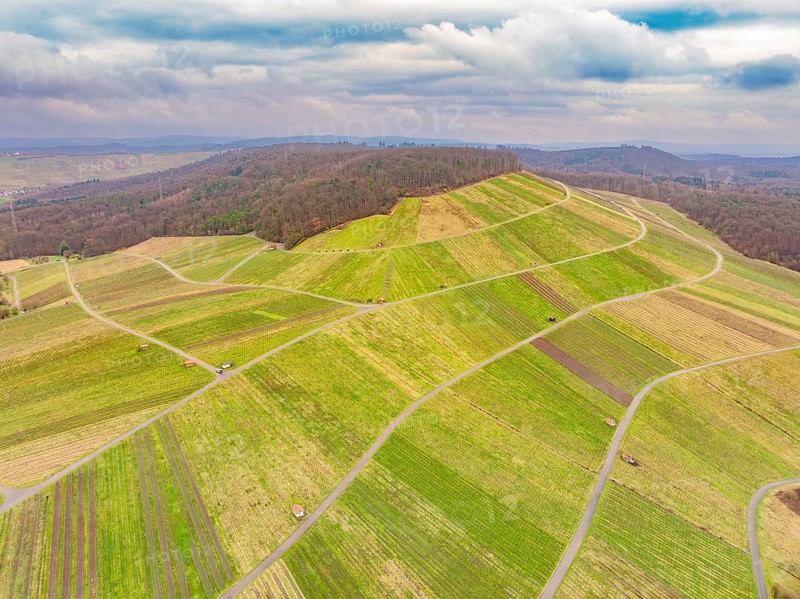 Wide, patterned fields on rolling hills under a cloudy sky, Großbottwar, Ludwigsburg district, Baden-Württemberg, Germany, Europe