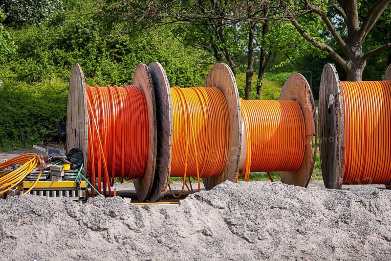 Duisburg, North Rhine-Westphalia, Germany, Internet broadband expansion, construction site for laying fibre optic cable, cable drum with fibre optic cable, new construction of fibre optic routes, fast Internet, DSL cable connection for households, Europe