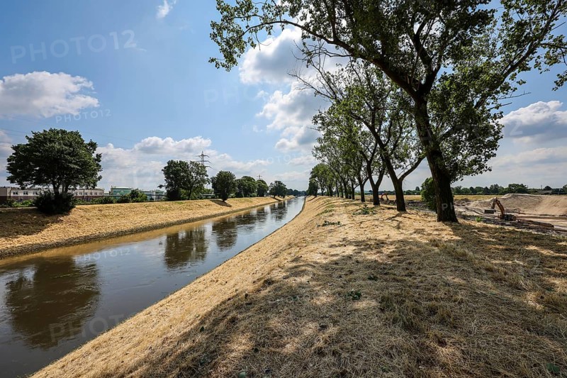 Oberhausen, North Rhine-Westphalia, Germany, renaturalisation of the Emscher in the Holtener Bruch. The currently straightened Emscher, shown here at flood level, has been given curves again and can meander through its new floodplain. The ecological conversion of the Emscher system consists of the construction of a centralised wastewater treatment system in the Ruhr region, the construction of sewers and the renaturation of the Emscher and its tributaries. Following the construction of a parallel sewer, the Emscher has been completely free of sewage since January 2022. The river was previously an open, above-ground combined sewer with rainwater and wastewater, Europe