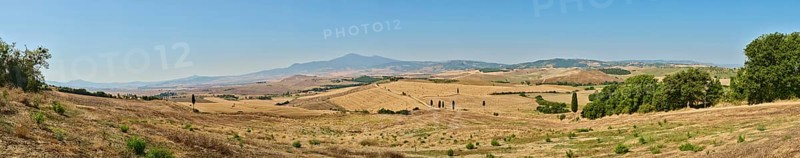 Typical Tuscan landscape in Val d'Orcia with hills, trees, fields, cypresses and farm road in autumn, gladiator film location, San Quirico d'Orcia, Val d'Orcia, Orcia Valley, UNESCO World Heritage Site, Siena Province, Tuscany, Italy, Europe