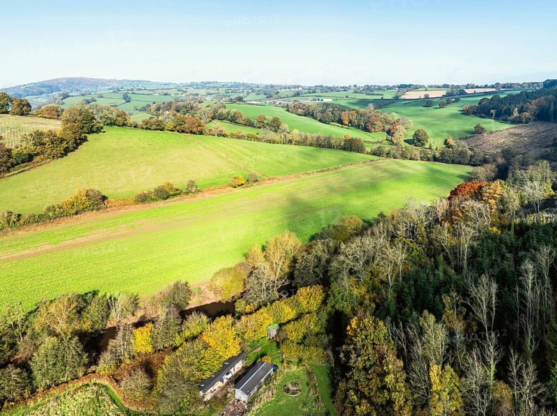 Fields and Farms over Skenfrith Castle from a drone, Monmouthshire, Wales, England, United Kingdom, Europe