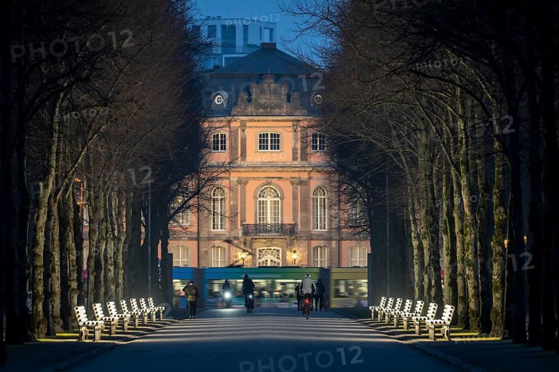 The light benches by artist Stefan Sous in the Hofgarten, entitled UV-A UV-B, 14 completely refurbished exhibits from the 2002 light-grey art exhibition, which now stand and light up as a permanent work of art on Jägerhofallee, LED technology, in the background Jägerhof Palace, home of the Goethe Museum, Düsseldorf, North Rhine-Westphalia, Germany, Europe
