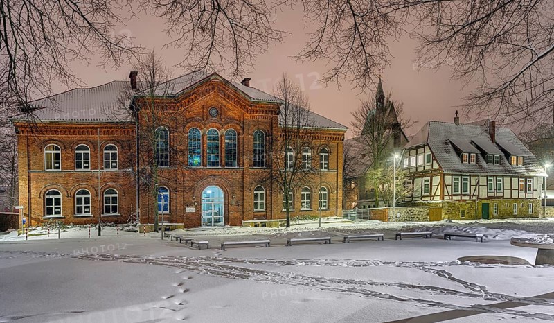 IGS and old Latin school illuminated by winter snow Stadthagen Germany