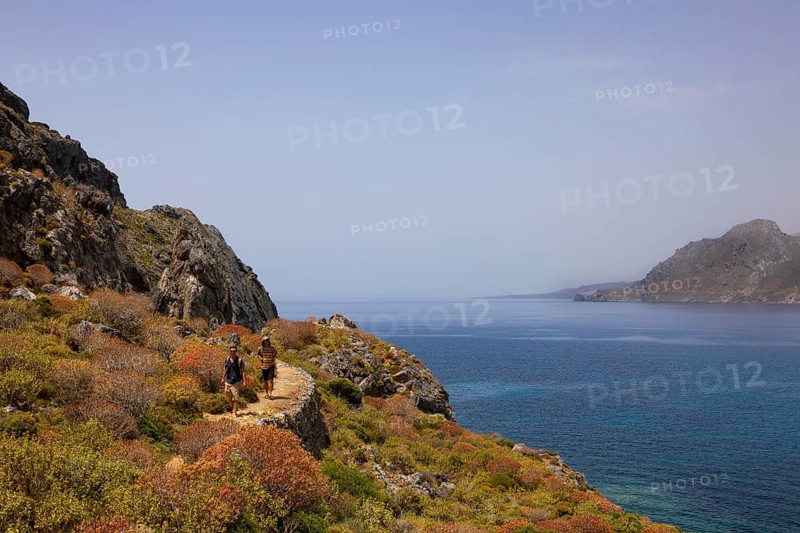 Hikers on the Sarella peninsula near Plakias, south coast, Crete, Greece, Europe