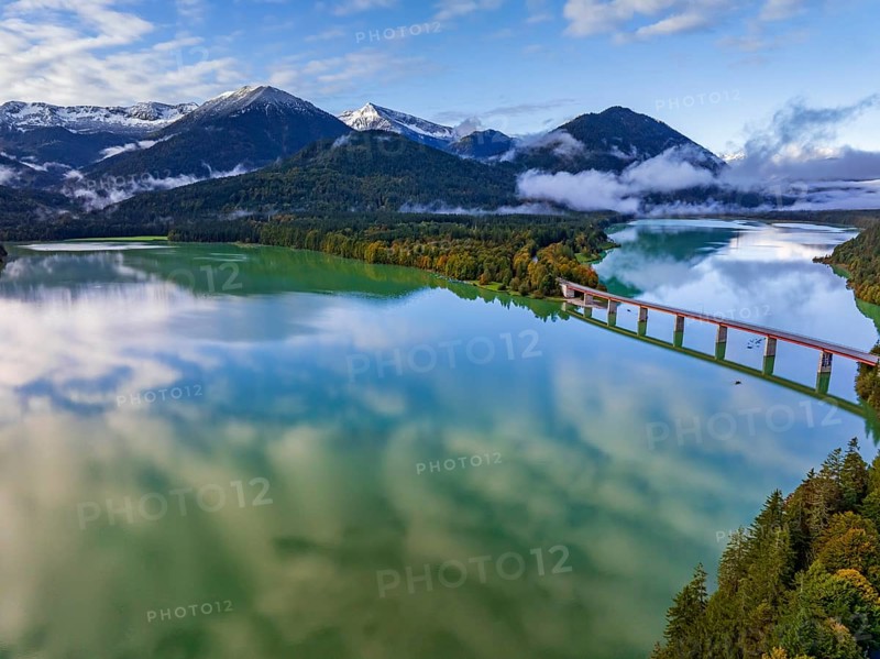 Snow-covered mountains reflected in lake, sunny, bridge, autumn, Sylvensteinsee, Karwendel Mountains, Bavaria, Germany, Europe