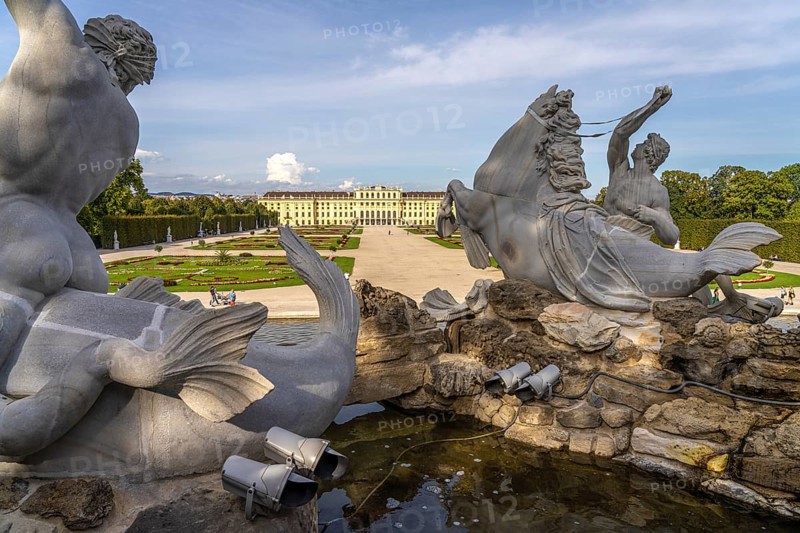 View through the Neptune Fountain to Schönbrunn Park and Palace, UNESCO World Heritage Site in Vienna, Austria, Europe