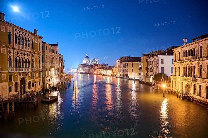 View on 'Canal Grande' at 'Ponte dell'Accademia' bridge to 'Basilica di Santa Maria della Salute' in Venice by night in winter, Italy, Europe