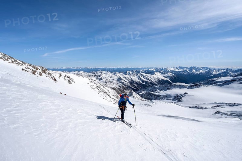 Ski tourers on the glacier, on the ascent to Monte Cevedale, mountain panorama, snow-covered mountain landscape in winter, view into the Martell Valley, high tour, Ortler Alps, Vinschgau Valley, Italy, Europe