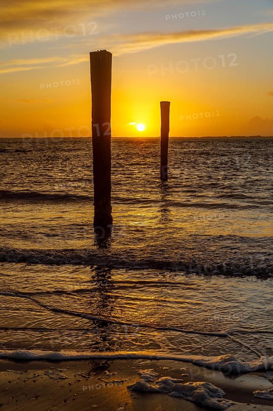 Intense sunset on the west beach of Norderney, Lower Saxony, Germany, Europe