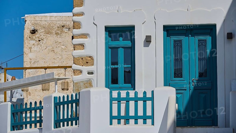 White building with turquoise door and traditional design, Chora, Astypalea, Dodecanese, Greek Islands, Greece, Europe