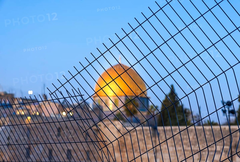 Islamic shrine Dome of Rock in the Old City seen through the fence. Symbol of Palestinian resistance and conflict