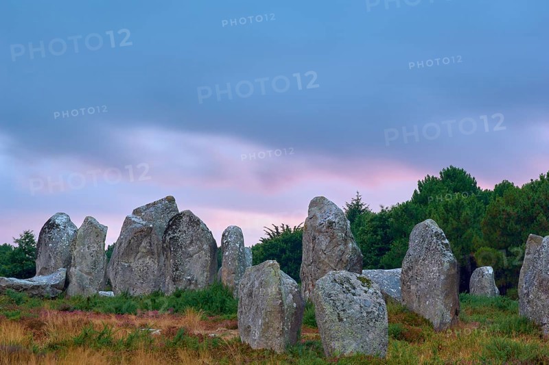 Neolithic menhirs, standing stones in Carnac with dramatic stormy sky, Carnac, Quiberon, Morbihan, Brittany, France, Europe