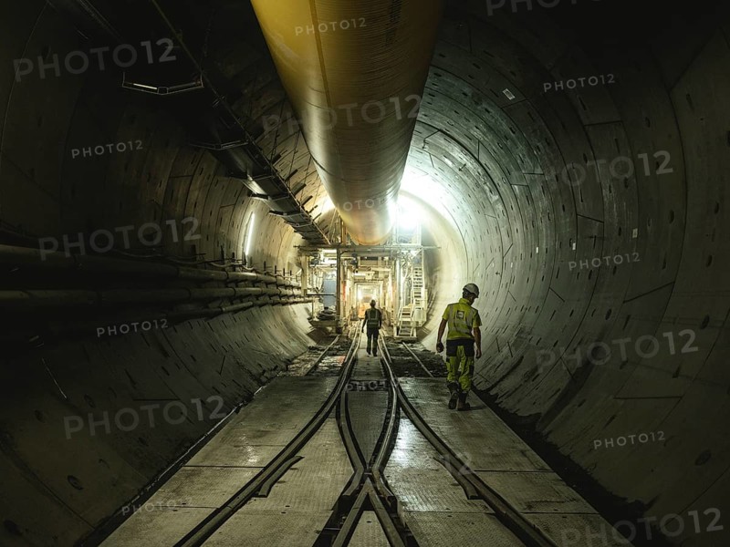 Workers in a tunnel section at the double-shield tunnel boring machine in section H53 of the Brenner Base Tunnel, Tyrol, Austria, Europe