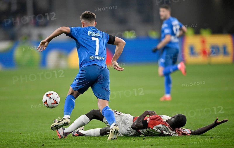 Duel, action Sael Kumbedi Olympique Lyon Lyonnais OL (20) on the ground against Tom Bischof TSG 1899 Hoffenheim (07) Europa League, PreZero Arena, Sinsheim, Baden-Württemberg, Germany, Europe