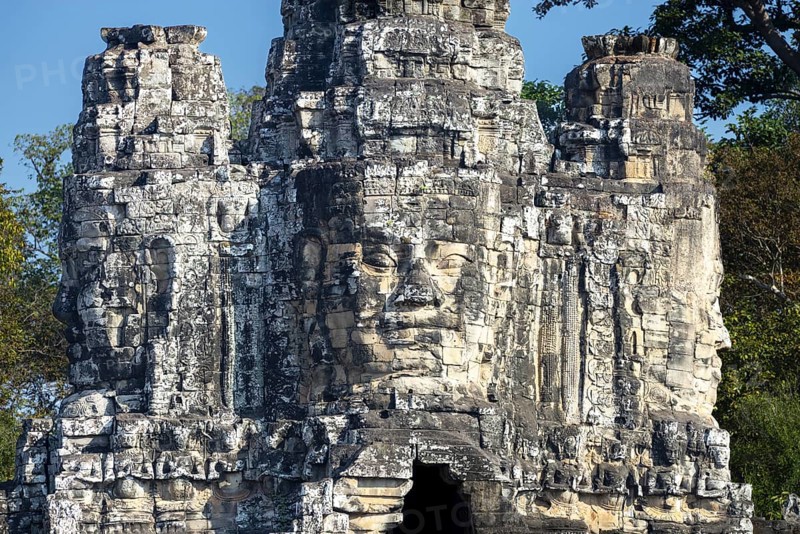 Giant stone-carved faces of the Bodhisattva Lokeshvara, also known as Avalokiteshvara, Angkor Thom Tor or Victory Gate in front of the Bayon Temple, Angkor Thom, UNESCO World Heritage Site, Angkor Wat, Siem Reap, Cambodia, Asia Angkor Thom Tor or Victory Gate, Asia
