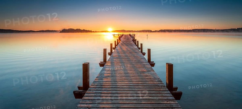 Jetty at Wörthsee at sunrise, fog on the water, Bavaria, Germany, Europe