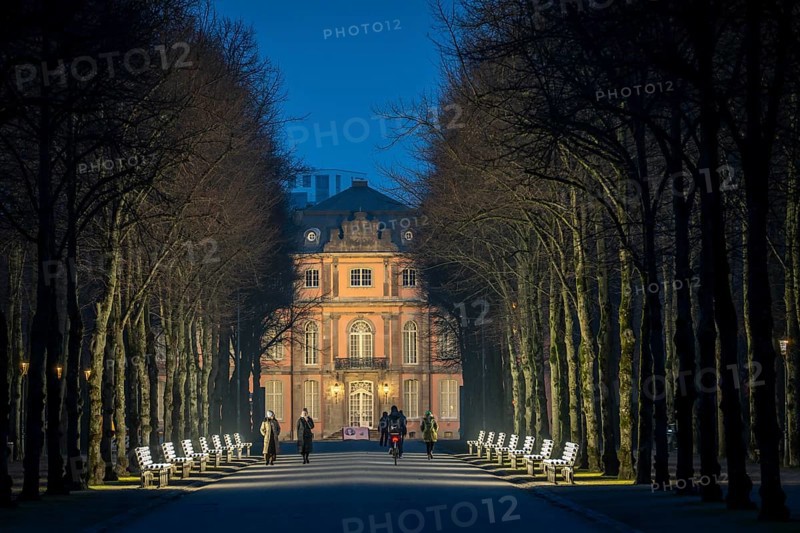 The light benches by artist Stefan Sous in the Hofgarten, entitled UV-A UV-B, 14 completely refurbished exhibits from the 2002 light-grey art exhibition, which now stand and light up as a permanent work of art on Jägerhofallee, LED technology, in the background Jägerhof Palace, home of the Goethe Museum, Düsseldorf, North Rhine-Westphalia, Germany, Europe