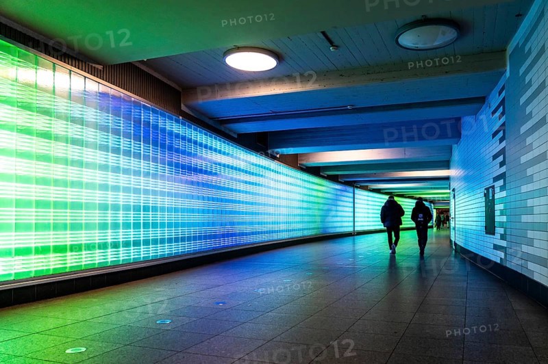 Passage under Essen's main railway station, connects entrances to the city and the main railway station, with the underground station, illuminated, LED wall, few people, Germany, Europe
