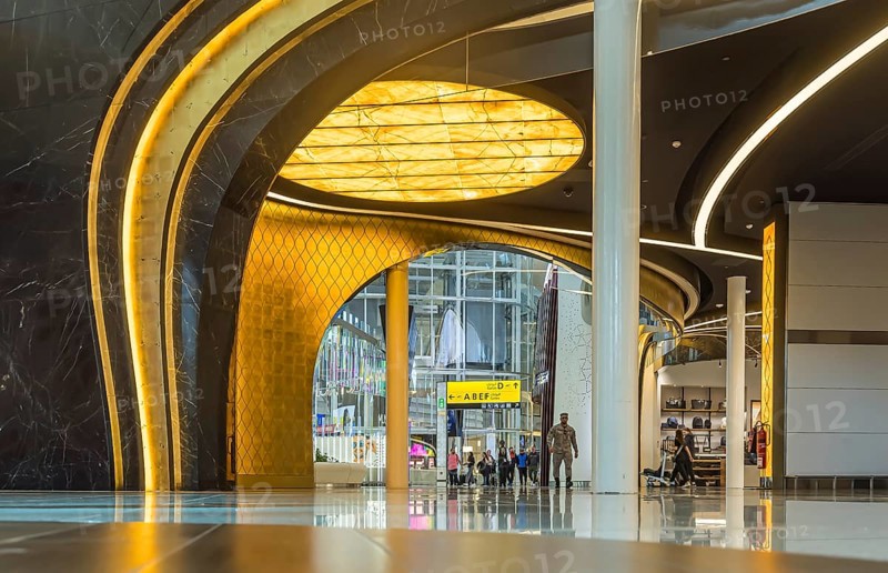 Abu Dhabi Airport, Zayed International Airport with passengers. Duty free shop. The new Terminal A has a capacity of 45 million passengers per year. Modern architecture. Abu Dhabi, United Arab Emirates, UAE, Asia