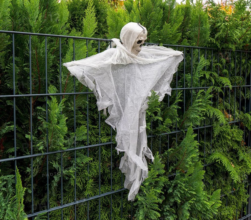 Ghost costume hanging on a fence, Berlin, Germany, Europe