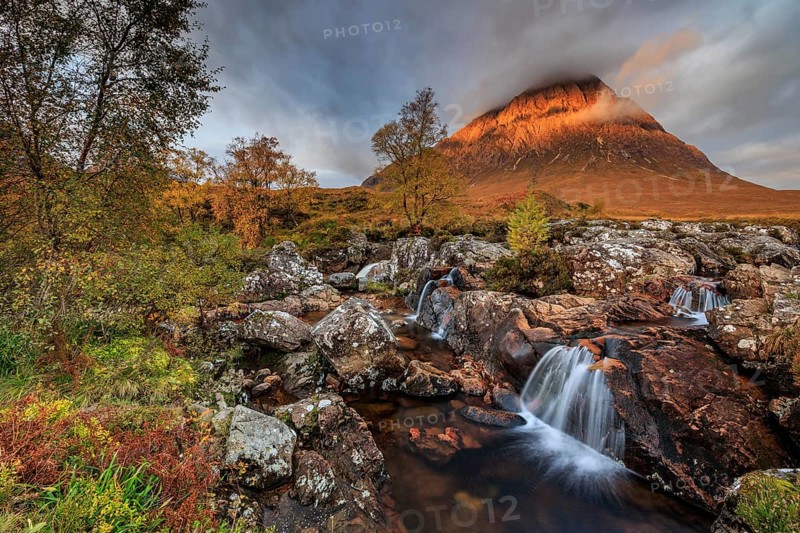 Wild river, waterfall, autumn colours, morning light, mountain landscape, cloudy mood, Buachaille Etive Mòr, Glencoe, Scottish Highlands, Scotland, Great Britain