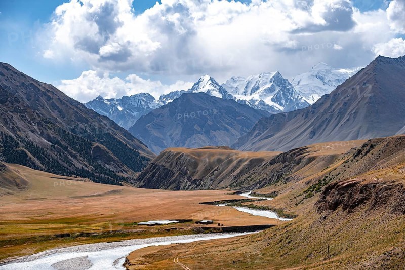 Mountain river in a valley, picturesque mountain landscape with white mountain peaks, Tian Shan Mountains, Issyk-Kul, Kyrgyzstan, Asia