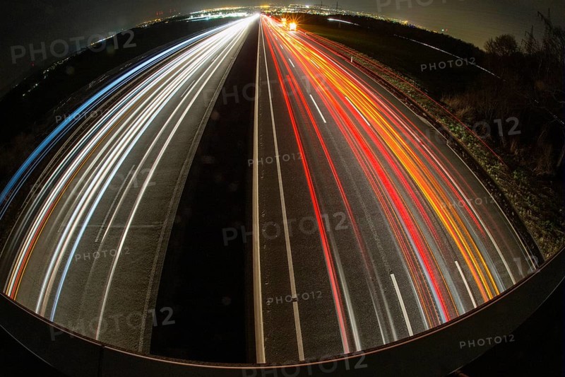 A7 Motorway, Autobahn, beside Kassel at night with light trails from the traffic headlights and taillights, Hesse, Germany, Europe